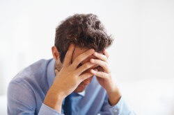 man high on mushrooms in business attire