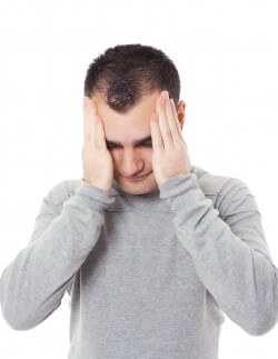 bigstock-young-man-having-a-headache-26372696